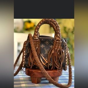 Mini speedy bag with handmade leather detailing